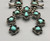 vintage squash blossom necklace, classic naja style with eight beautiful green turquoise cabochons, sterling silver and strung on a coated wire