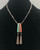 wonderful coral and turquoise tufa cast necklace by a well-known jewelry artist, tufa cast pendant with turquoise and coral cabochons