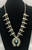 vintage box bow squash blossom necklace, 13 turquoise cabochons that are all accented with hand stamped designs, foxtail wire