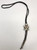 Knifewing theme inlay bolo tie, mother of pearl, onyx, turquoise, and coral, black leather cord with sterling silver tips