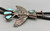 sterling silver and turquoise eagle dancer bolo tie, heavily accented with beautiful silverwork and hand stamped designs