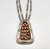 vintage coral cluster necklace, sawtooth bezels set in a shadowbox style display, straight lines, silver dots, triangular cut-outs