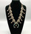 vintage unique style squash blossom necklace, fleur-de-lis style naja, natural turquoise, sterling silver, coated wire