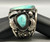 hefty three-stone turquoise bracelet, thin twisted wire along the edges, detailed applique, six wire terminal