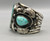 hefty three-stone turquoise bracelet, thin twisted wire along the edges, detailed applique, six wire terminal
