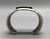 tufa cast and cobblestone inlay bracelet by Navajo artist, Harrison Jim, cobblestone inlay of wood, turquoise, onyx, and coral, geometric designs