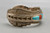 sterling and cobblestone inlay bracelet by Navajo artist, Harrison Jim, cobblestone inlay of turquoise and coral, brushed background