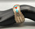 sterling and cobblestone inlay bracelet by Navajo artist, Harrison Jim, cobblestone inlay of turquoise and coral, brushed background
