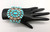 three-piece turquoise squash blossom set, petit point turquoise cabochons in handmade sawtooth bezels, bracelet, pin