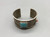 nice tufa cast Edison Cummings bracelet, turquoise cabochon, small coral cabochon, textured cuff