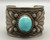 hefty turquoise and sterling silver bracelet, turquoise cabochon in a sawtooth bezel, twisted wire and silver applique