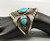 three-stone turquoise bracelet, turquoise cabochons in handmade sawtooth bezels, twisted wire, and intricate pieces of silver applique