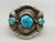 three-stone turquoise bracelet, turquoise cabochons in handmade sawtooth bezels, twisted wire, and intricate pieces of silver applique