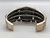 hefty three-stone bracelet by Navajo artist, Rick Martinez, retro style, well accented with twisted wire and silver dots, five wire terminal