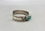 turquoise and sterling silver snake bracelet by Zuni artist, Effie Calavaza, handmade sawtooth bezels, snake design, hand stamped designs