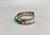 turquoise and sterling silver snake bracelet by Zuni artist, Effie Calavaza, handmade sawtooth bezels, snake design, hand stamped designs