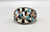 1950-1960s era Rainbowman inlay bracelet, mother of pearl, turquoise, spiny oyster, and onyx, lightly accented with fine hand stamped designs