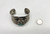 unique Hopi sterling silver tufa cast bracelet, stylized, three dimensional Kachina motif with a turquoise cabochon affixed to the nice tufa cast