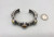 nice sterling silver and five-stone turquoise bracelet, five turquoise cabochons with a loop of twisted wire, filework and hand stamped designs