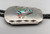 circa 1960s-1970s multi-stone inlay bolo tie, turquoise, mother of pearl, coral, deep silver cut outs, braided black leather cord