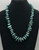 vintage turquoise nugget and fine heishi necklace, strung on a wax cord, conjoined by silver findings