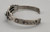 circa 1930's sterling silver turquoise bracelet, "snake-eye" turquoise cabochons, silver floral designs