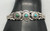 circa 1930's sterling silver turquoise bracelet, "snake-eye" turquoise cabochons, silver floral designs