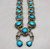 circa 1970s turquoise and sterling silver squash blossom necklace, silver dots and loops of twisted wire, sterling silver, coated wire