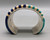 Lovely cobblestone inlay with stunning wide sterling silver cuff with intricate overlay of a Hopi pueblo