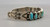 eleven natural turquoise cabochons in a row