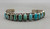eleven natural turquoise cabochons in a row
