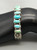 eleven natural turquoise cabochons in a row