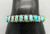 eleven natural turquoise cabochons in a row