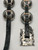 10 magnificent conchos set on a black leather belt