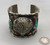 buffalo head silverwork with additional decorative dots, stamping, loop and leaf applique