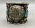 buffalo head silverwork with additional decorative dots, stamping, loop and leaf applique