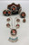 mudhead themed coral inlay, bracelet, five-pendant necklace, ring, and six-piece concho belt