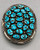 27 turquoise cabochons set in wonderful clusters, surrounded by silver dots, and twisted wire