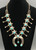 three turquoise cabochons on the naja, a single turquoise dangle, and 10 turquoise cabochons