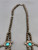 three turquoise cabochons on the naja, a single turquoise dangle, and 10 turquoise cabochons