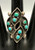 eight snake-eye turquoise cabochons, in clusters, circa 1940's