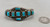 nine old natural rectangular cut turquoise cabochons in handmade bezels, accented with twisted wire and silver dots
