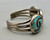 flush, turquoise channel inlay, geometric design on a ring, bracelet, and pendant