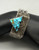 unique multi style turquoise bracelet by Richard Tsosie, offset triangular turquoise stone, tufa cast design