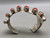 coral cuff bracelet, award winning artist Na Na Ping, modernistic wave design, 8 coral cabochons, handmade bezels