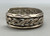 older handmade coin silver marked bracelet, carinated bands with conjoined ends, center twisted wire, hand stamped designs