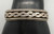 older handmade coin silver marked bracelet, carinated bands with conjoined ends, center twisted wire, hand stamped designs