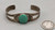 turquoise and sterling silver bracelet, 1930s-1940s era, central turquoise cabochon, smooth bezel, hand stamped designs, 2 wire terminal, conjoined ends
