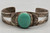 turquoise and sterling silver bracelet, 1930s-1940s era, central turquoise cabochon, smooth bezel, hand stamped designs, 2 wire terminal, conjoined ends