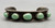 5 green turquoise stones, darkened silver background, silver dots